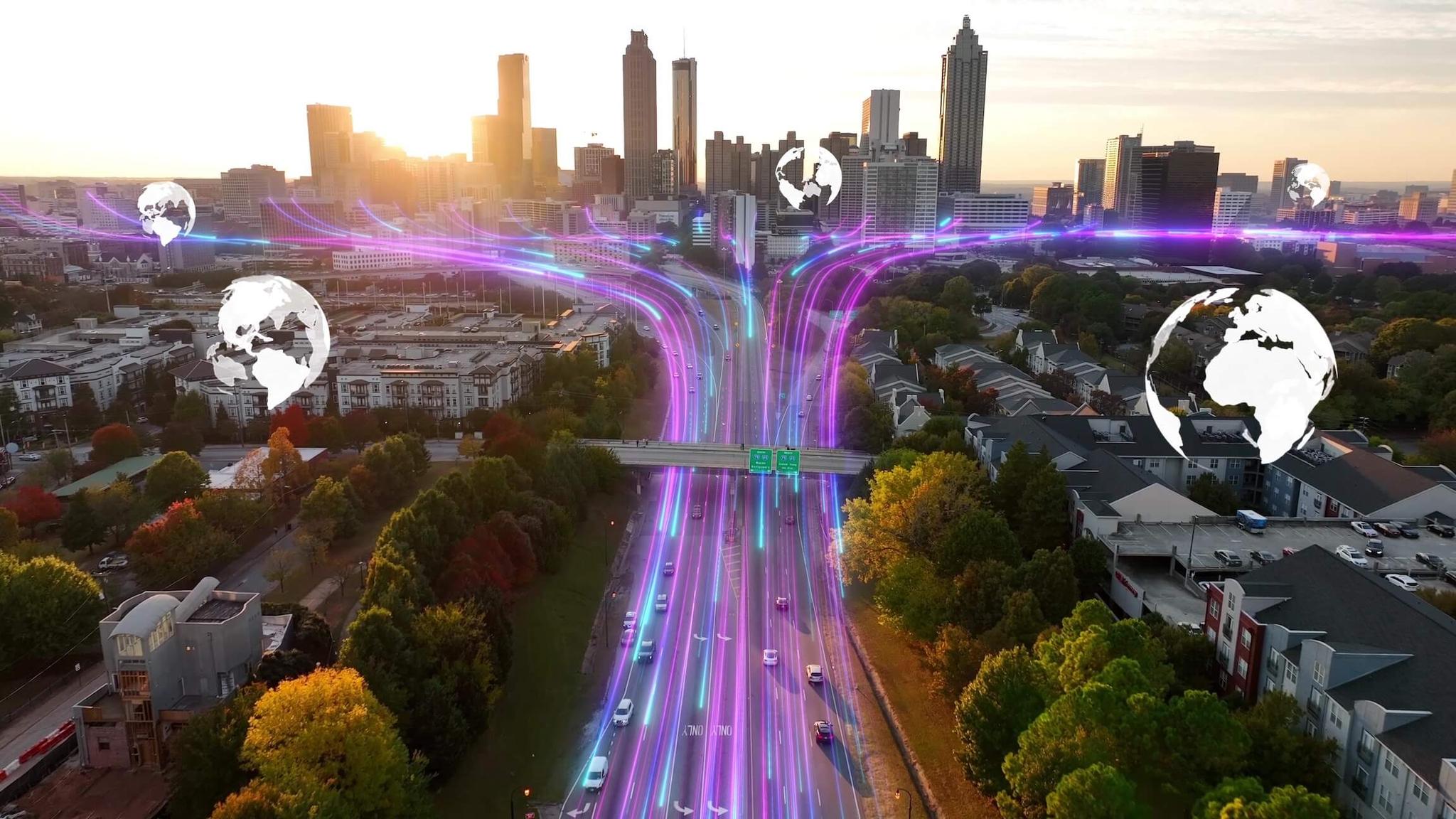 Purple and blue fiber optic light streams travel over highway into a city