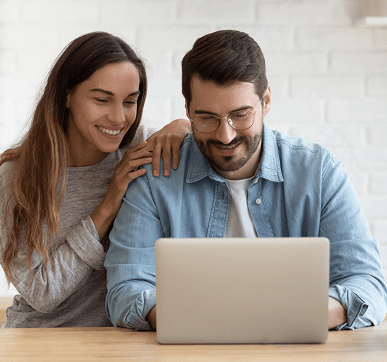 couple viewing laptop