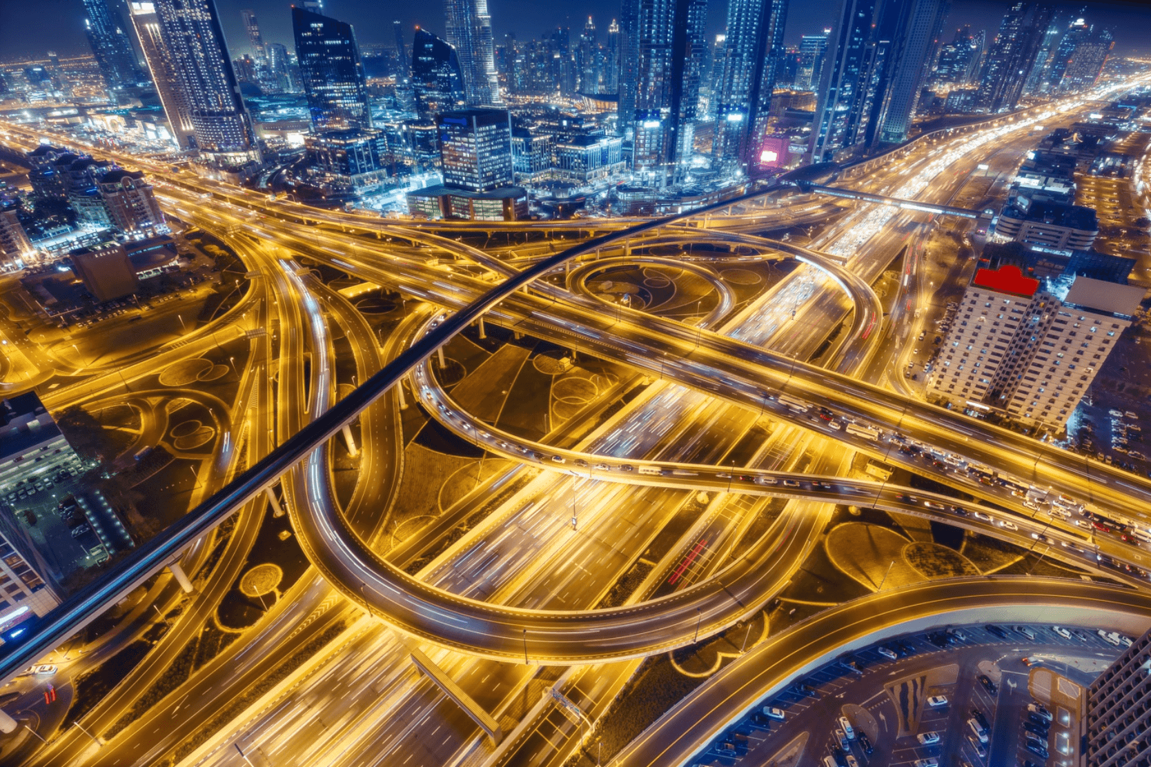 High-level view of a glowing digital highway with digital cityscape in background