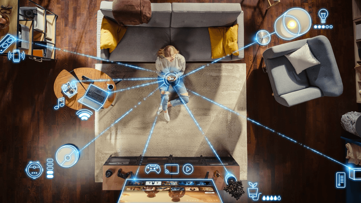 blog/Overhead shot of a woman managing Wi-Fi connection to several smart devices around her home