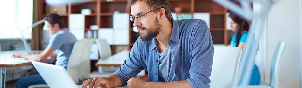 People at a library use the internet
