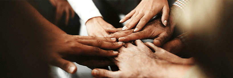 Diverse Hands Making a Pact