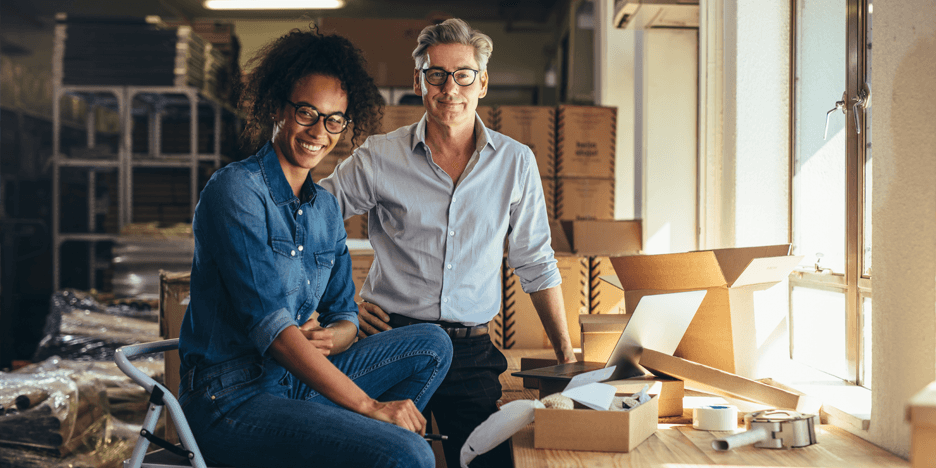 Small business owners packing orders