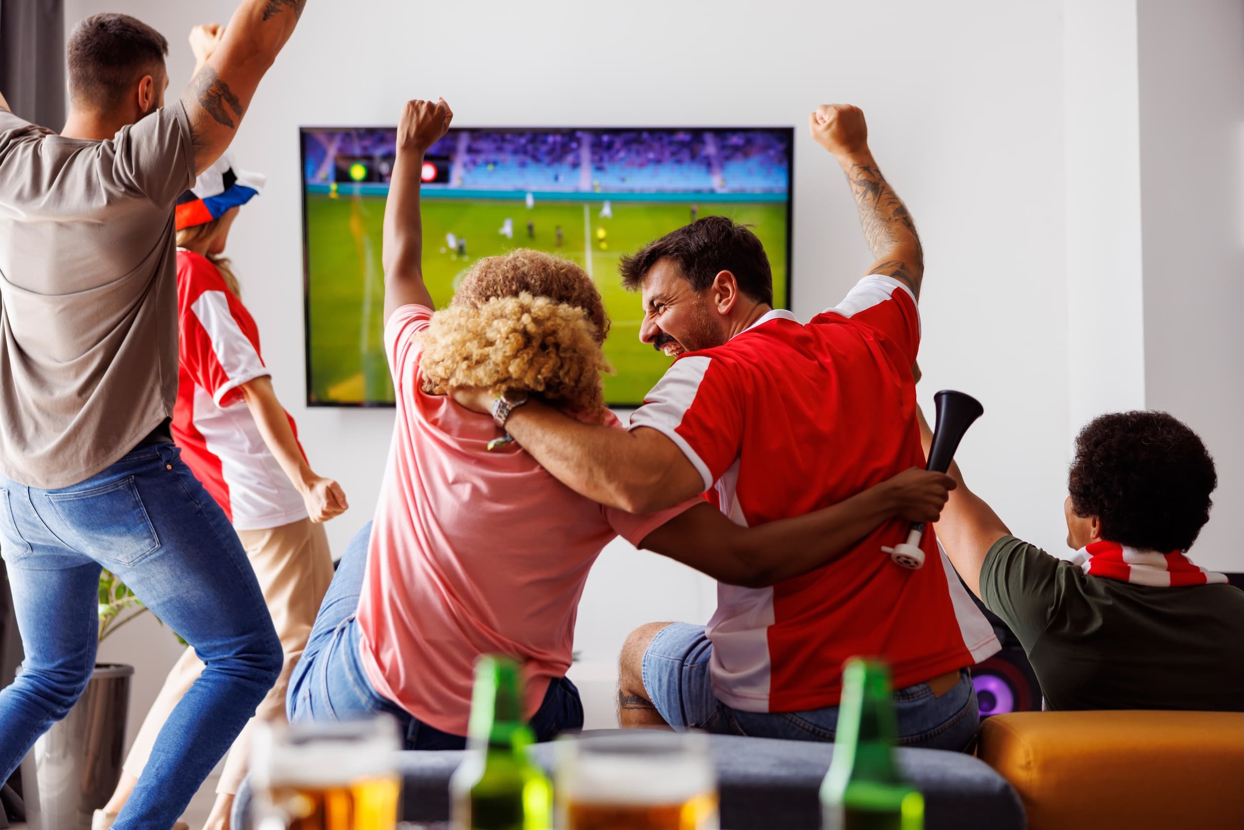 blog/Friends watching a soccer game celebrate
