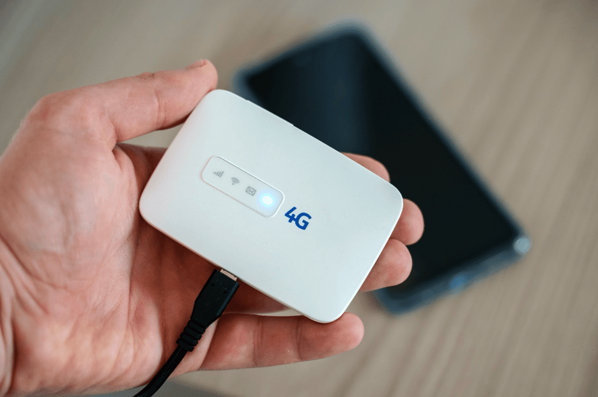Hand holding a 4G mobile data router