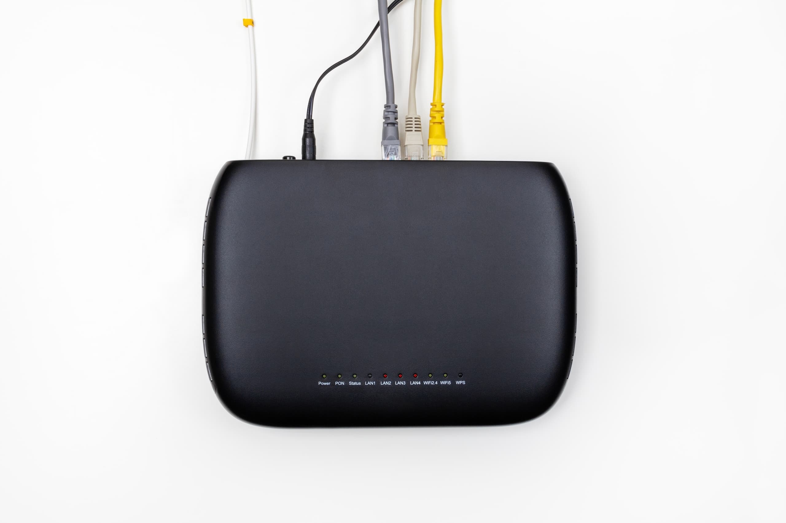 blog/Black optical network terminal with cables plugged into it