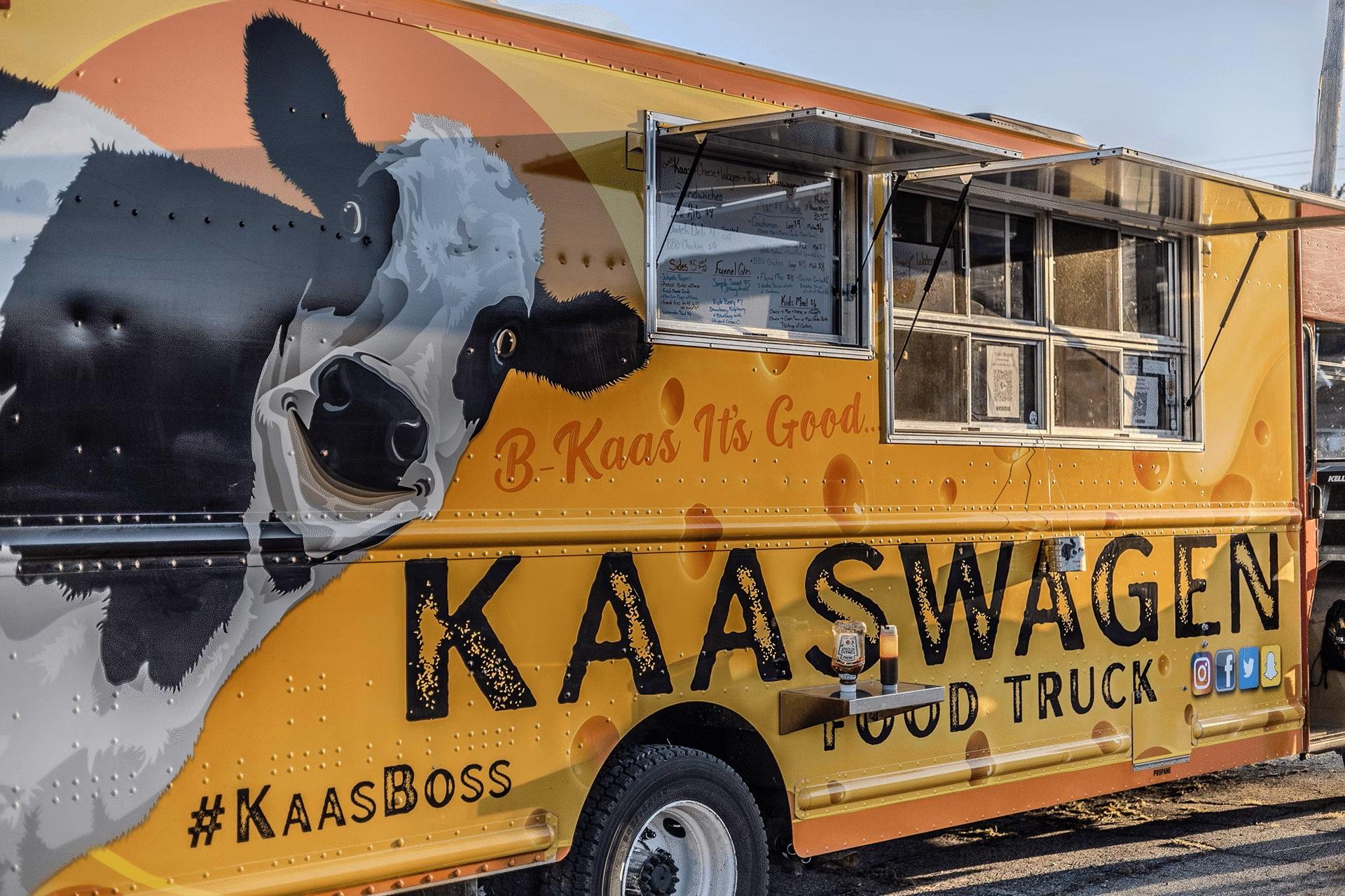 Kaaswagon food truck at a Kinetic Fiber Internet event with people enjoying carnival activities