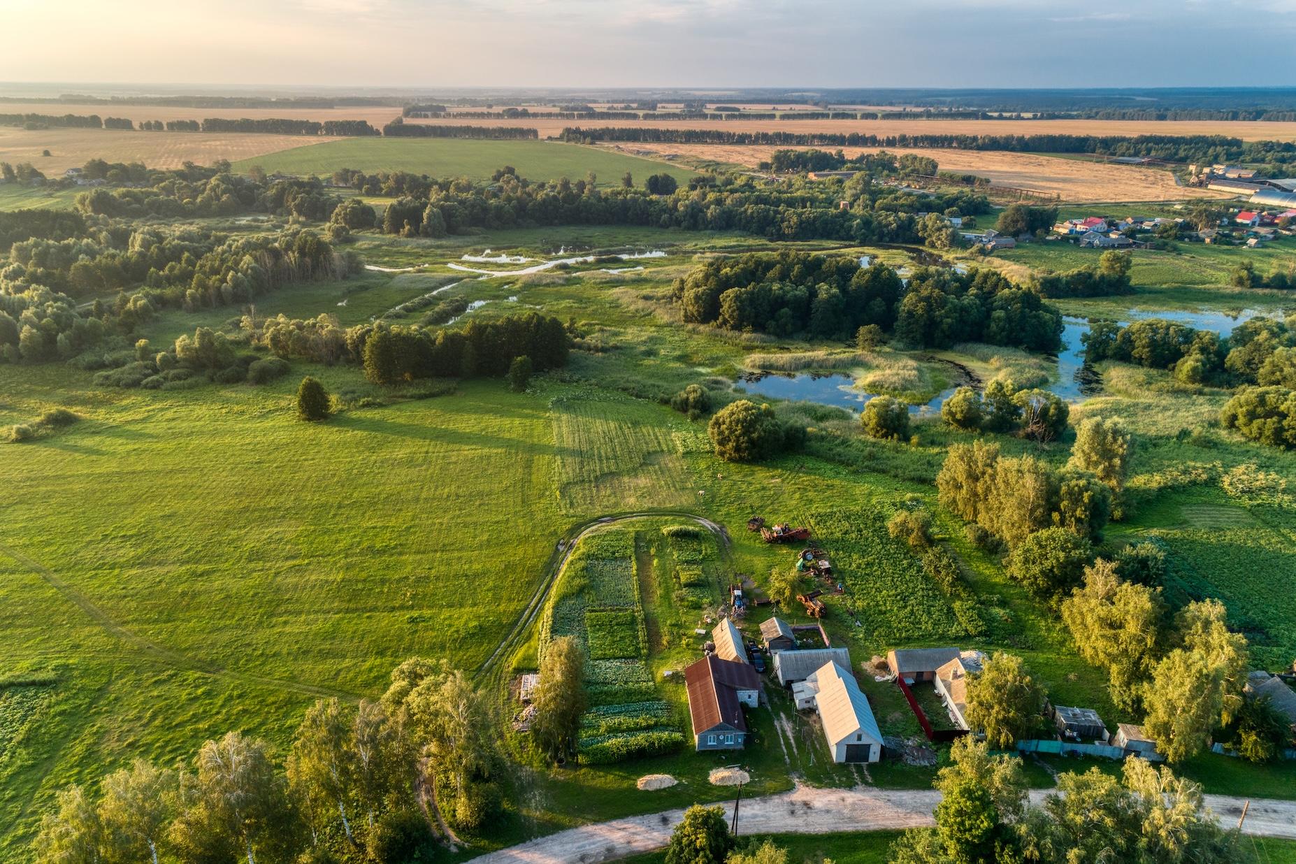 aerial view of a rural neighborhood and farms.